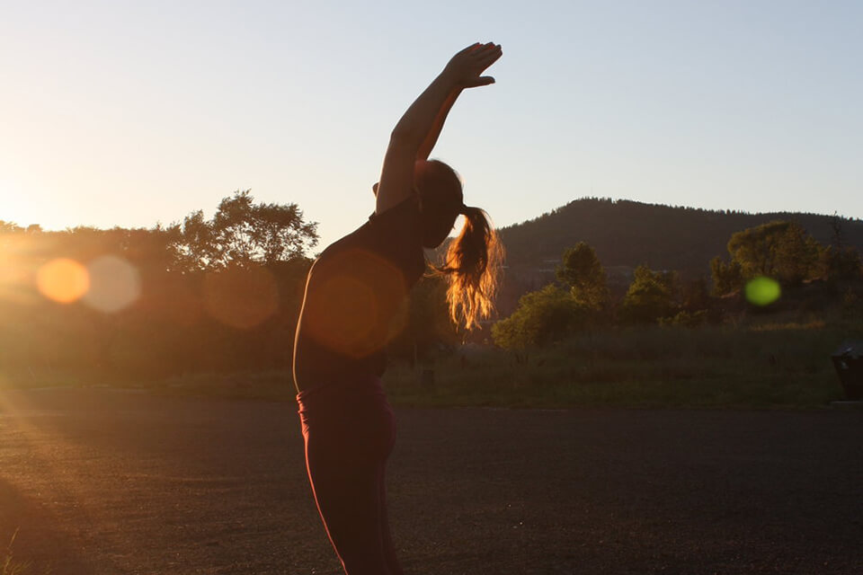 SHIFT Rehab Services - Injury Rehab Kelowna - Alicia Stretching Outside